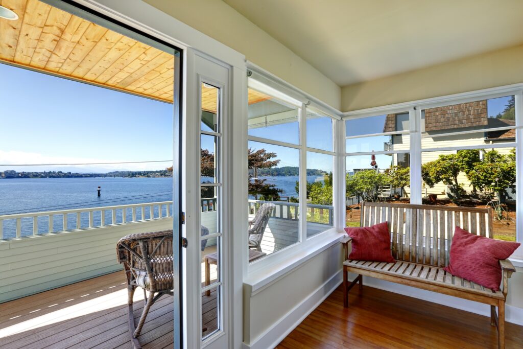 Sun room and walkout deck. American architecture. Real estate with water front view. Port Orchard, WA